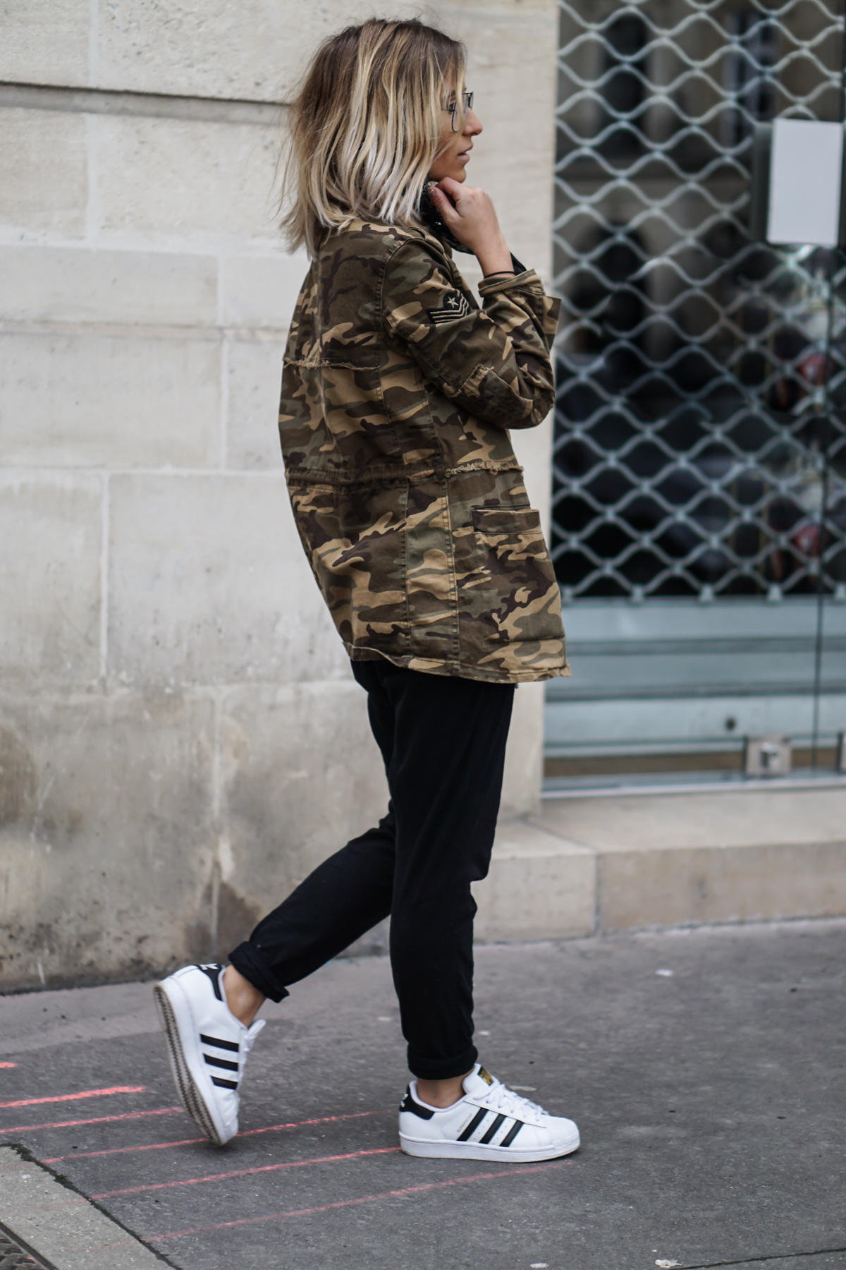 Nothing screams military more than a camouflage coat! Camille Callen rocks this Mango jacket, paired with androgynous style joggers and a pair of classic Adidas Superstars. Jacket: Mango, Joggers: Forever 21, Top: Zara, Sneakers: Adidas.
